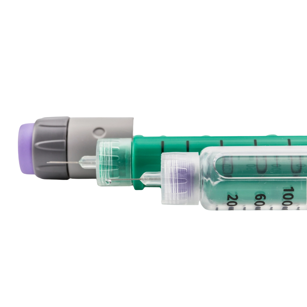 Close-up of an insulin pen with a visible cartridge and needle.